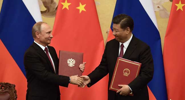 Vladimir Putin and Xi Jiping