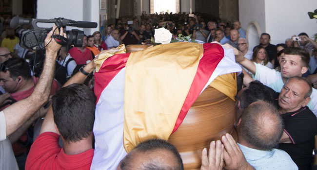Jose Antonio Reyes' coffin is carried through the streets of his hometown  before funeral in Spain