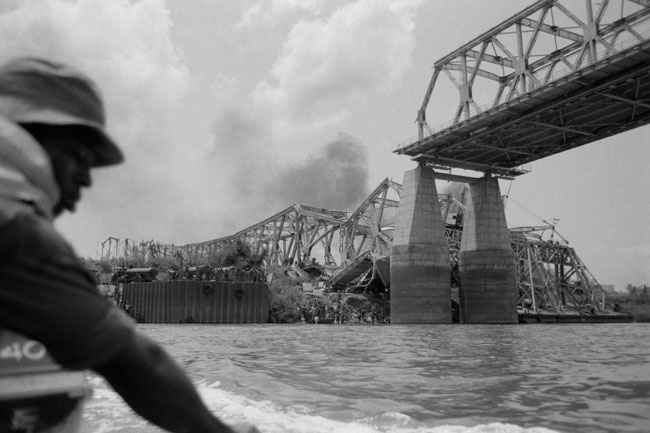 In this file photograph taken on March 31, 1968, The Onitsha bridge, one of the most important communication pathways of West Africa, is destroyed by the Biafran Forces, on the Niger River at Onitsha in south-eastern Nigeria. Colin HAYNES / AFP