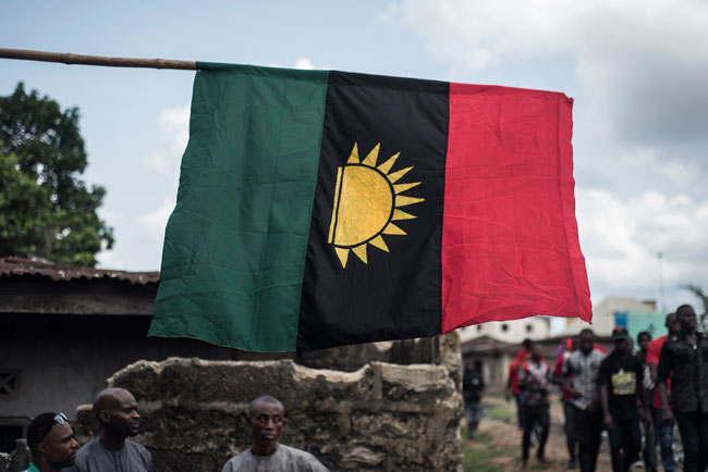 In this file photograph taken on May 28, 2017, supporters of the Indigenous People of Biafra (IPOB) march through the Osusu district in Aba. STEFAN HEUNIS / AFP