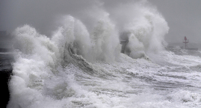Waves hit a jetty in Plobannalec-Lesconil, western Franceon February 9, 2020 as Storm Ciara sweeps across western Europe. Fred TANNEAU / AFP
