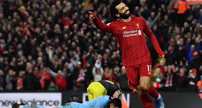 Liverpool's Egyptian midfielder Mohamed Salah celebrates after he scores his team's fourth goal during the English Premier League football match between Liverpool and Southampton at Anfield in Liverpool, north west England on February 1, 2020. Paul ELLIS / AFP