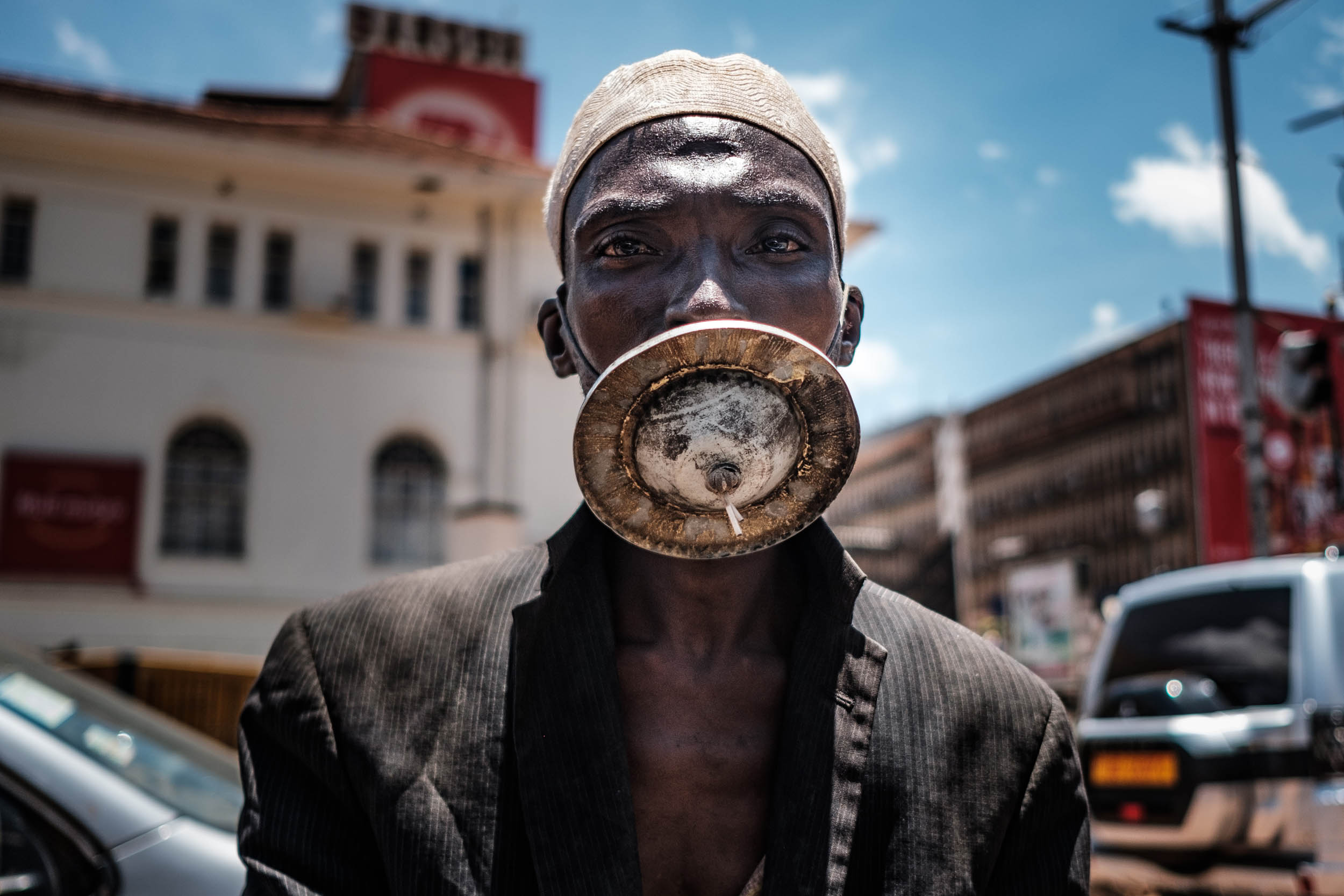 A man wearing an alternative mask poses for a photograph in Kampala, on April 1, 2020. - Ugandan President Yoweri Museveni on March 30, 2020, ordered an immediate 14-day nationwide lockdown in a bid to halt the spread of the COVID-19 coronavirus which has so far infected 33 people in the country. Photo: Sumy Sadurni / AFP