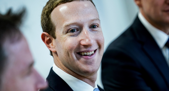 In this file photo Founder and CEO of US online social media and social networking service Facebook Mark Zuckerberg reacts upon his arrival for a meeting with European Commission vice-president in charge for Values and Transparency, in Brussels, on February 17, 2020. Kenzo TRIBOUILLARD / AFP