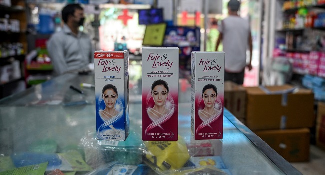 This photo taken on July 8, 2020 shows packages of Unilever "Fair and Lovely" skin-lightening creams on the counter of a shop in New Delhi. - Multinationals have long profited from sales of whitening creams, facewash and even vaginal bleaching lotions, by advertising the message that beauty, success and love are only for pale-skinned people. Now, companies like Unilever say they "want to lead the celebration of a more diverse portrayal of beauty". (Photo by Sajjad HUSSAIN / AFP) / TO GO WITH India-Indonesia-Thailand-Philippines-lifestyle-health-racism-gender-caste,FOCUS by Glenda Kwek, Ammu Kannampilly and Archana Thiyagarajan