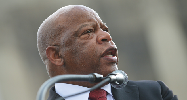 In this file photo taken on February 27, 2013 Rep. John Lewis, D-GA, speaks during a press conference in front of the US Supreme Court on Capitol Hill in Washington, DC. MANDEL NGAN / AFP