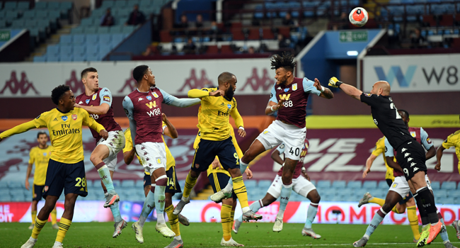 Aston Villa's Spanish goalkeeper Pepe Reina (R) jumps for the ball during the English Premier League football match between Aston Villa and Arsenal at Villa Park in Birmingham, central England on July 21, 2020. Shaun Botterill / POOL / AFP