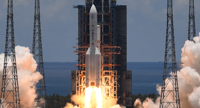 A Long March-5 rocket, carrying an orbiter, lander and rover as part of the Tianwen-1 mission to Mars, lifts off from the Wenchang Space Launch Centre in southern China's Hainan Province on July 23, 2020. Noel CELIS / AFP