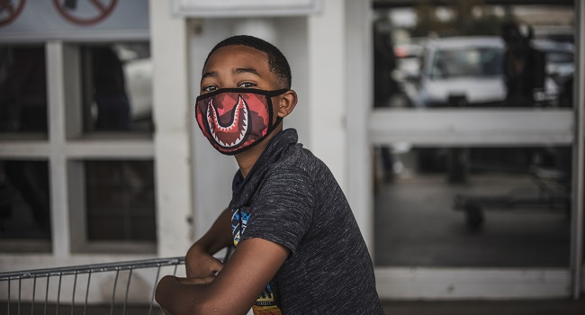 A boy wears a face mask as a preventive measure against the spred of the COVID 19