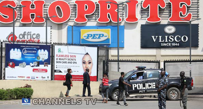 Police protect a shoprite store in Abuja amid protests against Xenophobic attacks on Nigerians in South Africa. Photo: Sodiq Adelakun/Channels TV