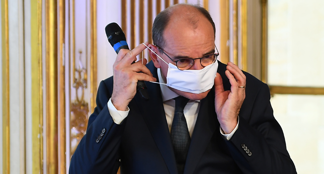 French Prime Minister Jean Castex puts his protective face mask on during a press conference on the situation of the novel coronavirus (Covid-19) in France, at the Hotel de Matignon in Paris on August 27, 2020. CHRISTOPHE ARCHAMBAULT / POOL / AFP