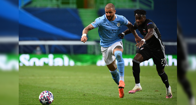 Manchester City's English defender Kyle Walker (L) vies with Lyon's Ivorian forward Maxwel Cornet during the UEFA Champions League quarter-final football match between Manchester City and Lyon at the Jose Alvalade stadium in Lisbon on August 15, 2020. FRANCK FIFE / POOL / AFP