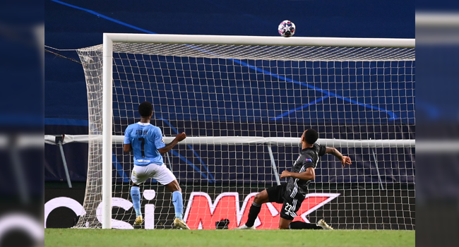 Manchester City's English midfielder Raheem Sterling (L) misses a goal opportunity during the UEFA Champions League quarter-final football match between Manchester City and Lyon at the Jose Alvalade stadium in Lisbon on August 15, 2020. FRANCK FIFE / POOL / AFP