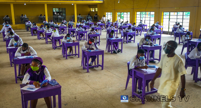 Wearing face-masks, final year students of Government Secondary School, Zone 3, Abuja, sit in a classroom as they write their West African Examinations Council exams, following the ease of COVID-19 lockdown order on Monday August 17, 2020. Photo: Sodiq Adelakun/Channels Television.