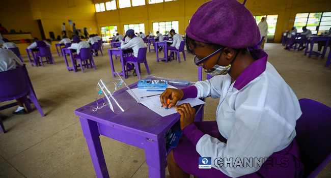 Wearing face-masks, final year students of Government Secondary School, Zone 3, Abuja, sit in a classroom as they write their West African Examinations Council exams, following the ease of COVID-19 lockdown order on Monday August 17, 2020. Photo: Sodiq Adelakun/Channels Television.