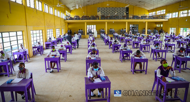 Wearing face-masks, final year students of Government Secondary School, Zone 3, Abuja, sit in a classroom as they write their West African Examinations Council exams, following the ease of COVID-19 lockdown order on Monday August 17, 2020. Photo: Sodiq Adelakun/Channels Television.