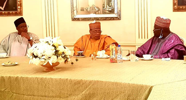 (L-R) Bauchi State Governor, Bala Mohammed, former Head of State, Ibrahim Babangida and former Niger State Governor, Aliyu Babangida discuss during a PDP reconciliation committee visit to former Head of State Babangida in Minna on September 26, 2020.