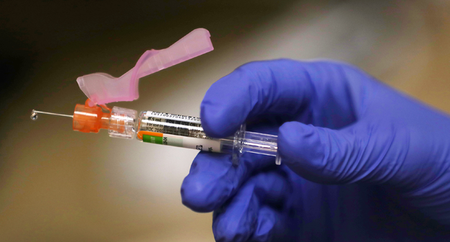 Enbal Sabag, a Nurse Practitioner, prepares a flu vaccination for a patient at the CVS Pharmacy and MinuteClinic on September 03, 2020 in Key Biscayne, Florida. Joe Raedle/Getty Images/AFP