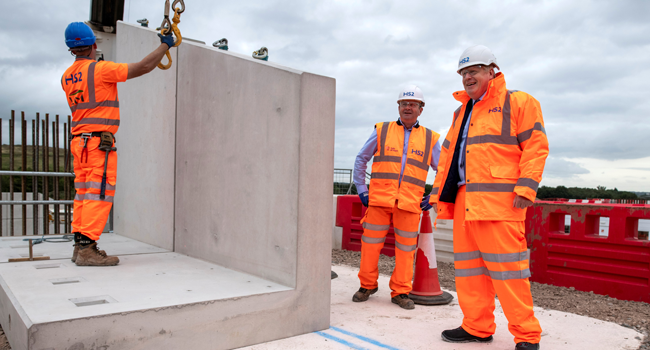 Britain's Prime Minister Boris Johnson (R) reacts during his visit to the Solihull Interchange construction site for the HS2 high-speed railway project, near Birmingham, central England on September 4, 2020. Andrew Fox / POOL / AFP