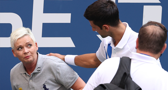 Novak djokovic of serbia tends to a line judge who was hit with the ball during his men's singles fourth round match against pablo carreno busta of spain on day seven of the 2020 us open at the usta billie jean king national tennis center on september 6, 2020 in the queens borough of new york city. Al bello/getty images/afp