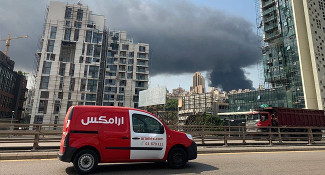 A picture taken from Dbayeh, north of Beirut, shows smoke from a huge fire raging at the port in the Lebanese capital on September 10, 2020. Thick black columns of smoke rose into the sky, as the army said it had engulfed a warehouse storing engine oil and vehicle tyres. Joseph EID / AFP