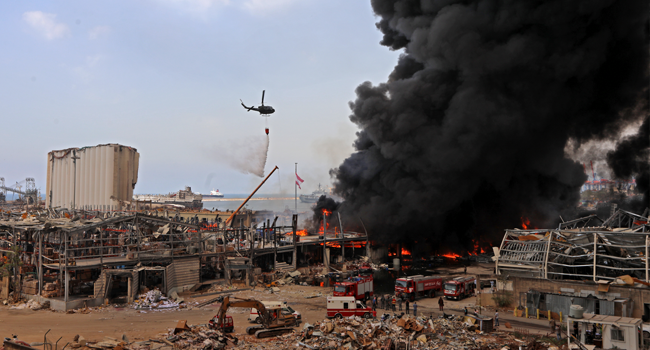 Lebanese firefighters try to put out a fire that broke out at Beirut's port area, on September 10, 2020. Thick black columns of smoke rose into the sky, as the army said it had engulfed a warehouse storing engine oil and vehicle tyres. ANWAR AMRO / AFP