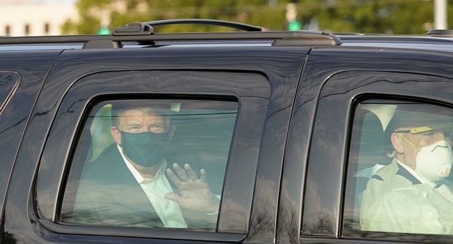 Trump in a black SUV