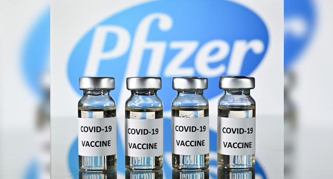 An illustration picture shows vials with Covid-19 Vaccine stickers attached, with the logo of US pharmaceutical company Pfizer, on November 17, 2020. JUSTIN TALLIS / AFP