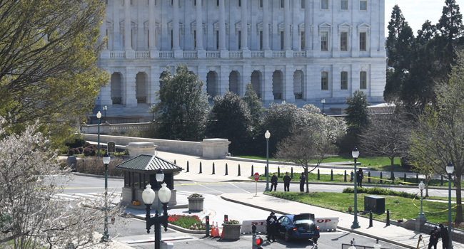 A car is seen crashed into a barrier near the US Capitol on April 2, 2021 in Washington, DC. Eric BARADAT / AFP