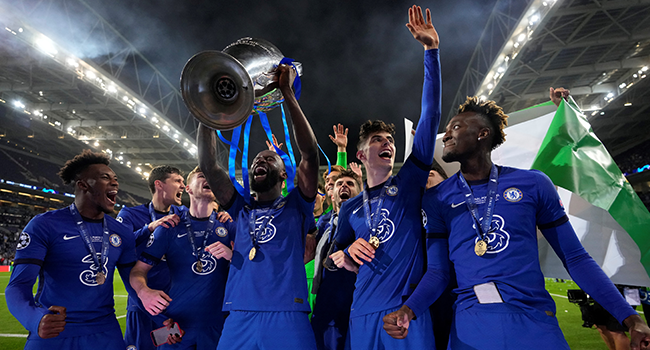 Chelsea's German defender Antonio Ruediger lifts the Champions League trophy during the UEFA Champions League final football match between Manchester City and Chelsea at the Dragao stadium in Porto on May 29, 2021. Manu Fernandez / POOL / AFP