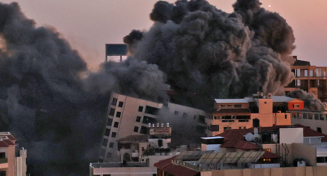 Smoke billows from an Israeli air strike on the Hanadi compound in Gaza City, controlled by the Palestinian Hamas movement, on May 11, 2021. MOHAMMED ABED / AFP