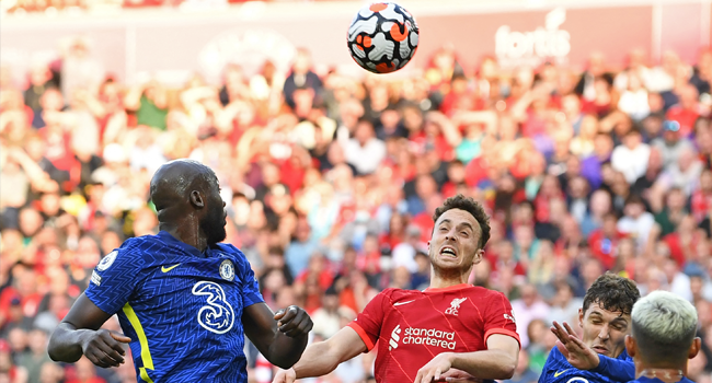 Liverpool's Portuguese striker Diogo Jota (C) vies with Chelsea's Belgian striker Romelu Lukaku (L) and Chelsea's Danish defender Andreas Christensen (R) during the English Premier League football match between Liverpool and Chelsea at Anfield in Liverpool, north west England on August 28, 2021. Paul ELLIS / AFP