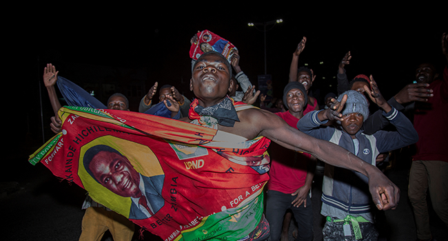 Supporters of Zambian presidential candidate for the opposition party United Party for National Development (UPND) Hakainde Hichilema celebrate his election as Zambian President in Lusaka, on August 16, 2021. Salim DAWOOD / AFP