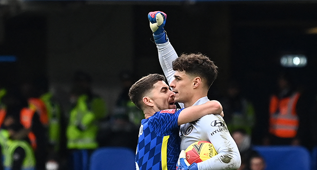 Chelsea's Spanish goalkeeper Kepa Arrizabalaga (R) celebrates with Chelsea's Italian midfielder Jorginho (L) after saving a late penalty kick from Plymouth's Scottish striker Ryan Hardie (not pictured) during the English FA Cup fourth round football match between Chelsea and Plymouth Argyle at Stamford Bridge in London on February 5, 2022. Glyn KIRK / AFP