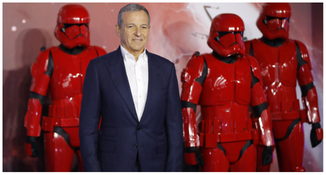 In this file photo taken on December 18, 2019 Disney CEO Bob Iger poses on the red carpet with sith stormtroopers upon arrival for the European film premiere of Star Wars: The Rise of Skywalker in London.  (Photo by Tolga AKMEN / AFP) / NO USE AFTER MARCH 10, 2023 22:06:43 GMT