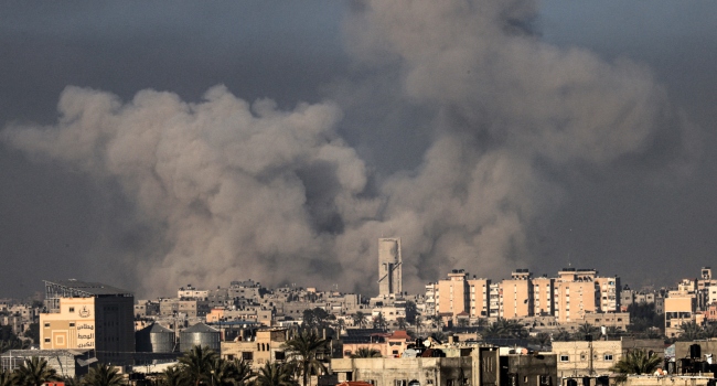 A picture taken from Rafah shows smoke billowing over Khan Yunis in the southern Gaza Strip during Israeli bombardment on January 21, 2024, amid ongoing battles between Israel and the Palestinian militant group Hamas.