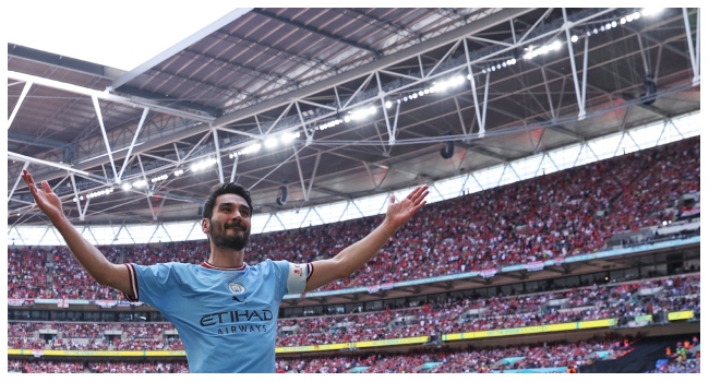 (FILES) Manchester City's German midfielder Ilkay Gundogan celebrates scoring his team's second goal during the English FA Cup final football match between Manchester City and Manchester United at Wembley stadium, in London, on June 3, 2023. Ilkay Gundogan said he had returned to the "best club in the world" after re-signing for Manchester City from Barcelona on on August 23, 2024. The former German international won five Premier League titles and the Champions League among 12 major trophies during his first spell at City between 2016 and 2023.