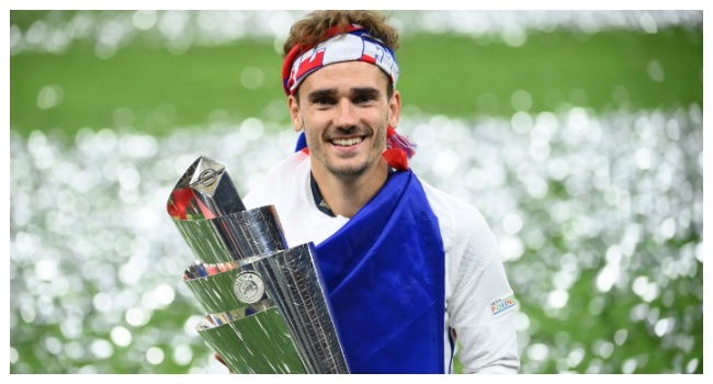 (FILES) France's forward Antoine Griezmann celebrates with the trophy at the end of the Nations League final football match between Spain and France at San Siro stadium in Milan, on October 10, 2021. (Photo by FRANCK FIFE / AFP)